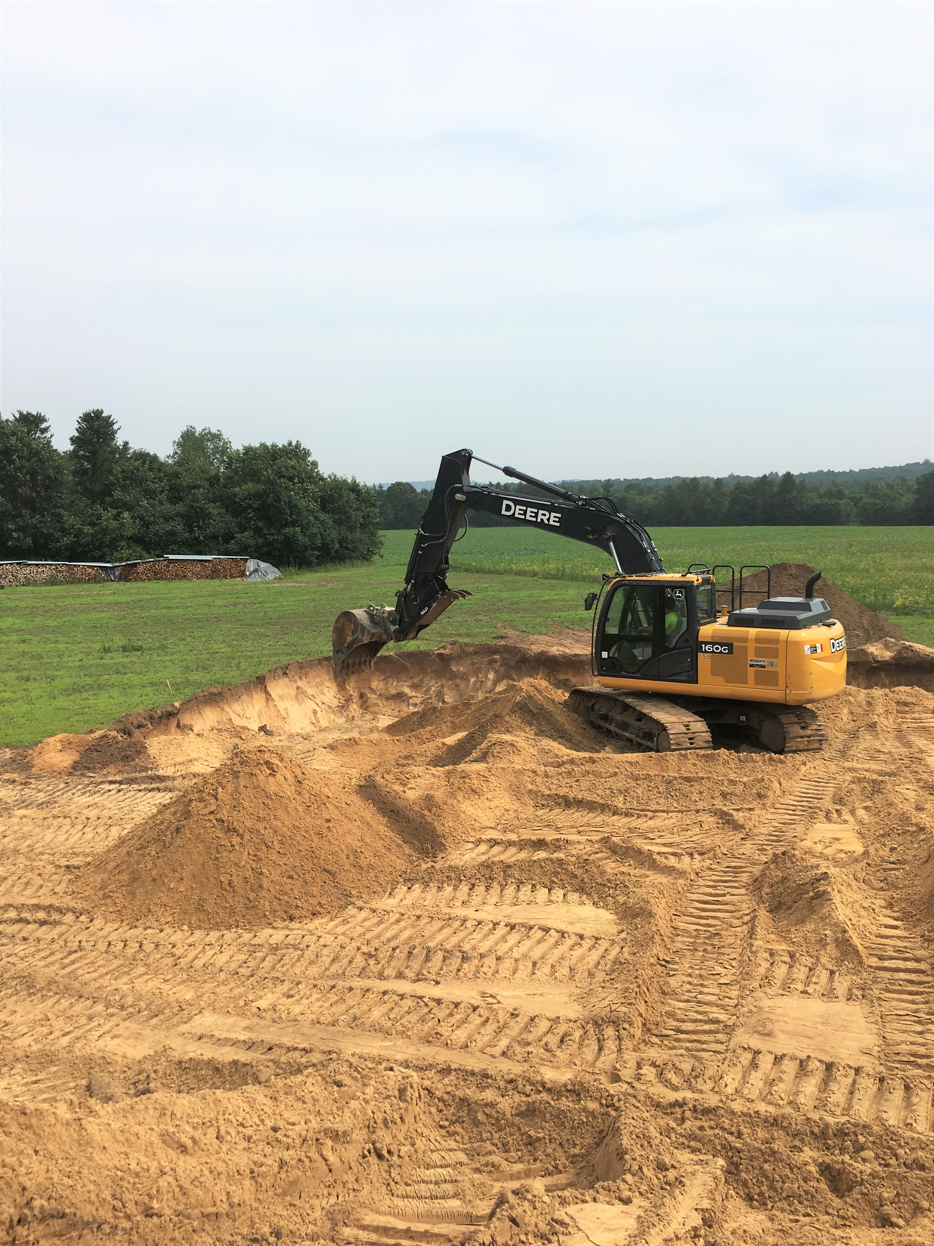 Excavator digging for a residential or commercial foundation